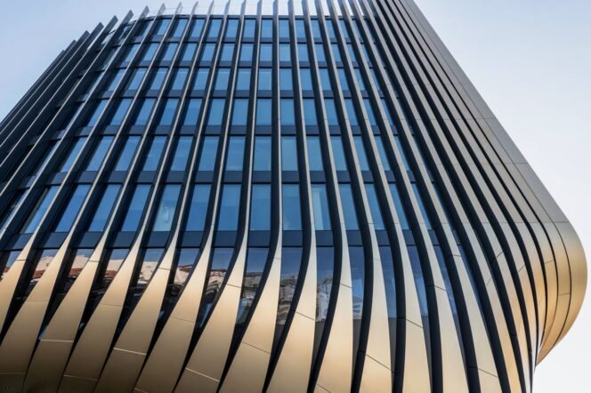 Modern skyscraper with unique geometric patterns in Prague, Czech Republic.